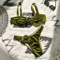 Green floral women's one-piece swimsuit with briefs style on a mannequin.