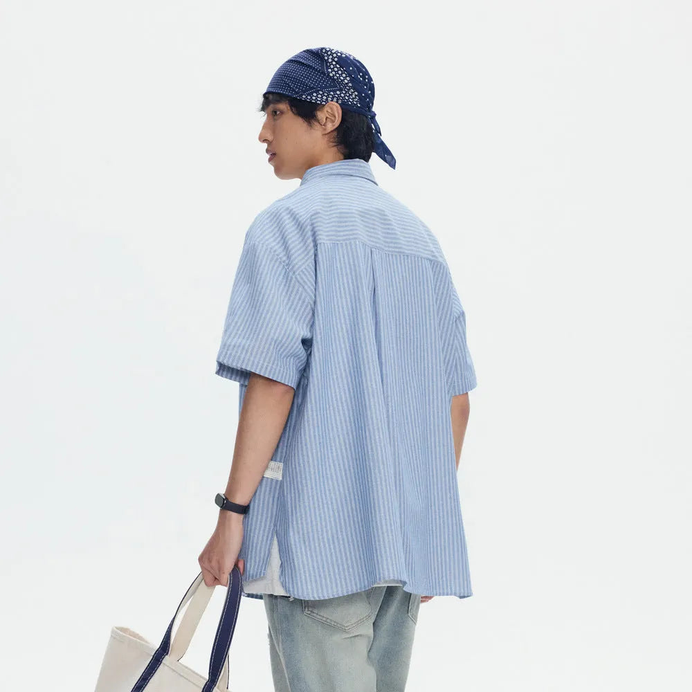 Blue striped short-sleeved overalls shirt with loose cardigan fit on hanger