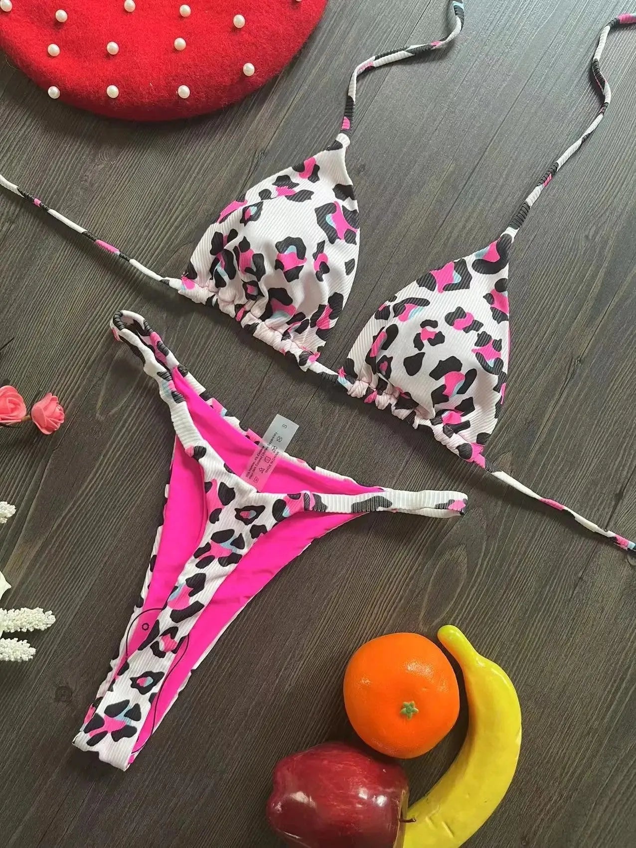 Women's bikini swimsuit with printed fabric in briefs style, showing high elasticity and cotton lining