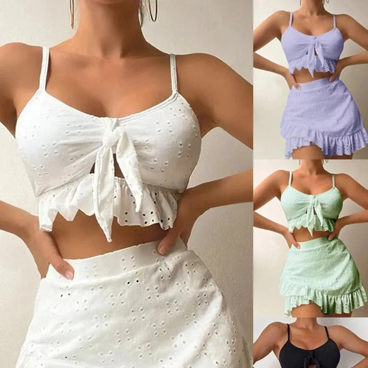 Women's solid colour three-piece skirt bikini swimsuit in polyester fabric.