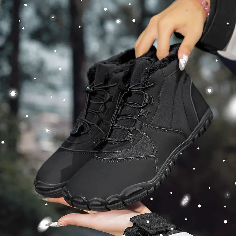 Black waterproof snow boots with lace-up front, fleece lining, and rubber sole on a winter background