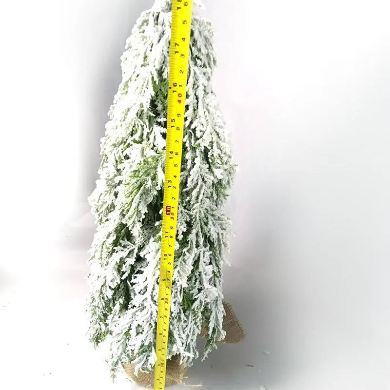 24-inch plastic Christmas tree with PE simulation snow spray effect and built-in lights on desktop