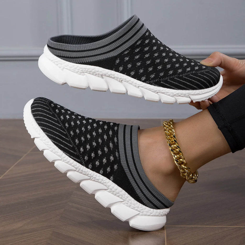 Women's black Flyknit semi slippers with hollowed-out sewing line detail and viscose sole