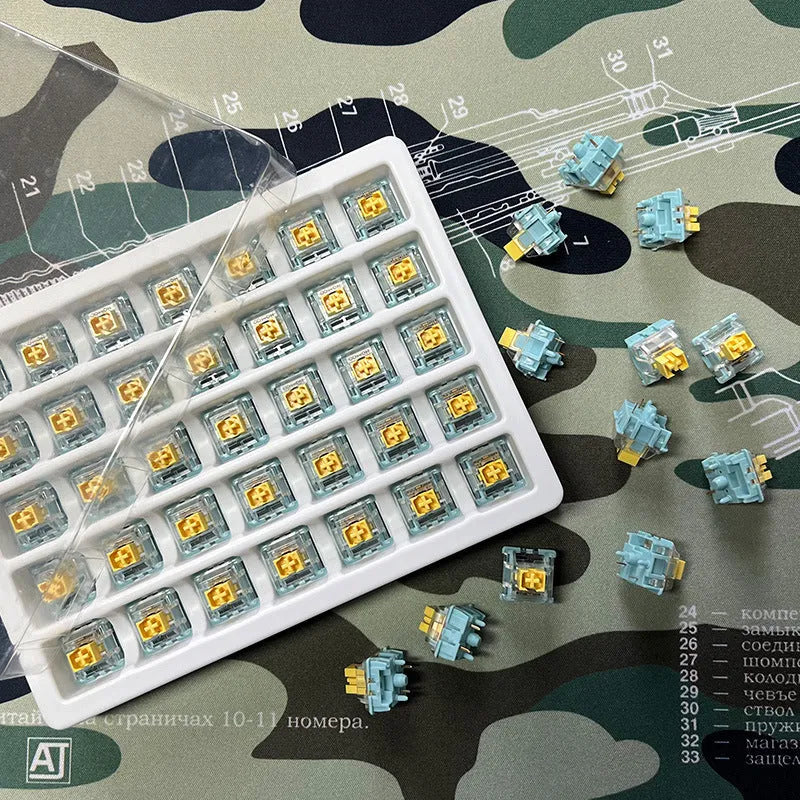 36 Sea Salt Lemon PRO Mute mechanical keyboard switches with transparent housings on a white background.