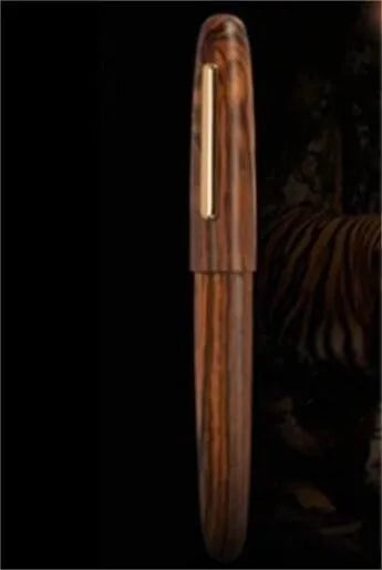 Wooden fountain pen with rotating cap showing natural wood grain