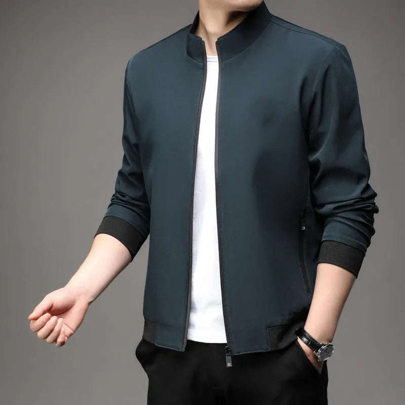 Korean style loose fit casual jacket in black with zip and patch pockets on a man.