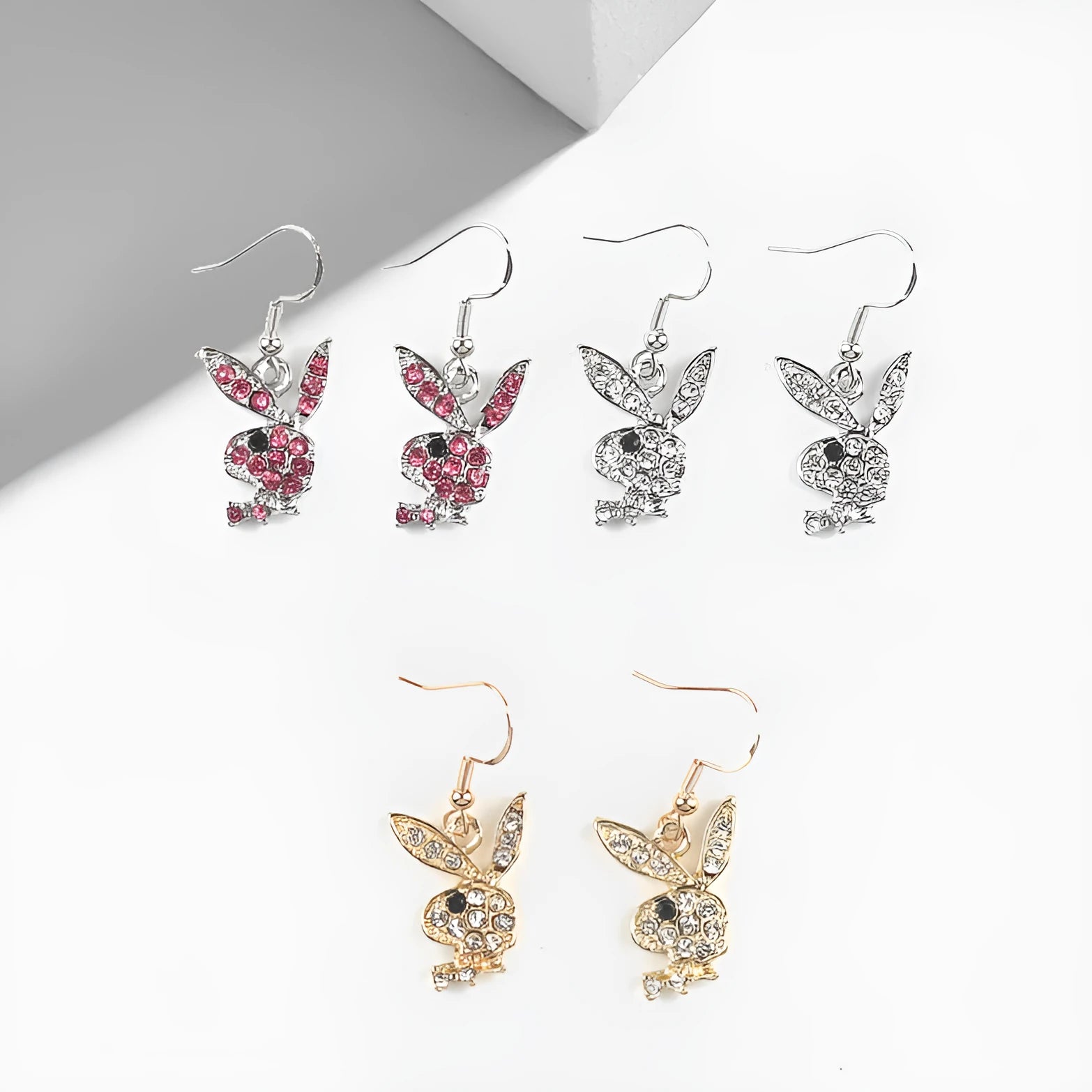 Cute rabbit-shaped stud earrings with diamond detail in silver, pink, or gold colour.