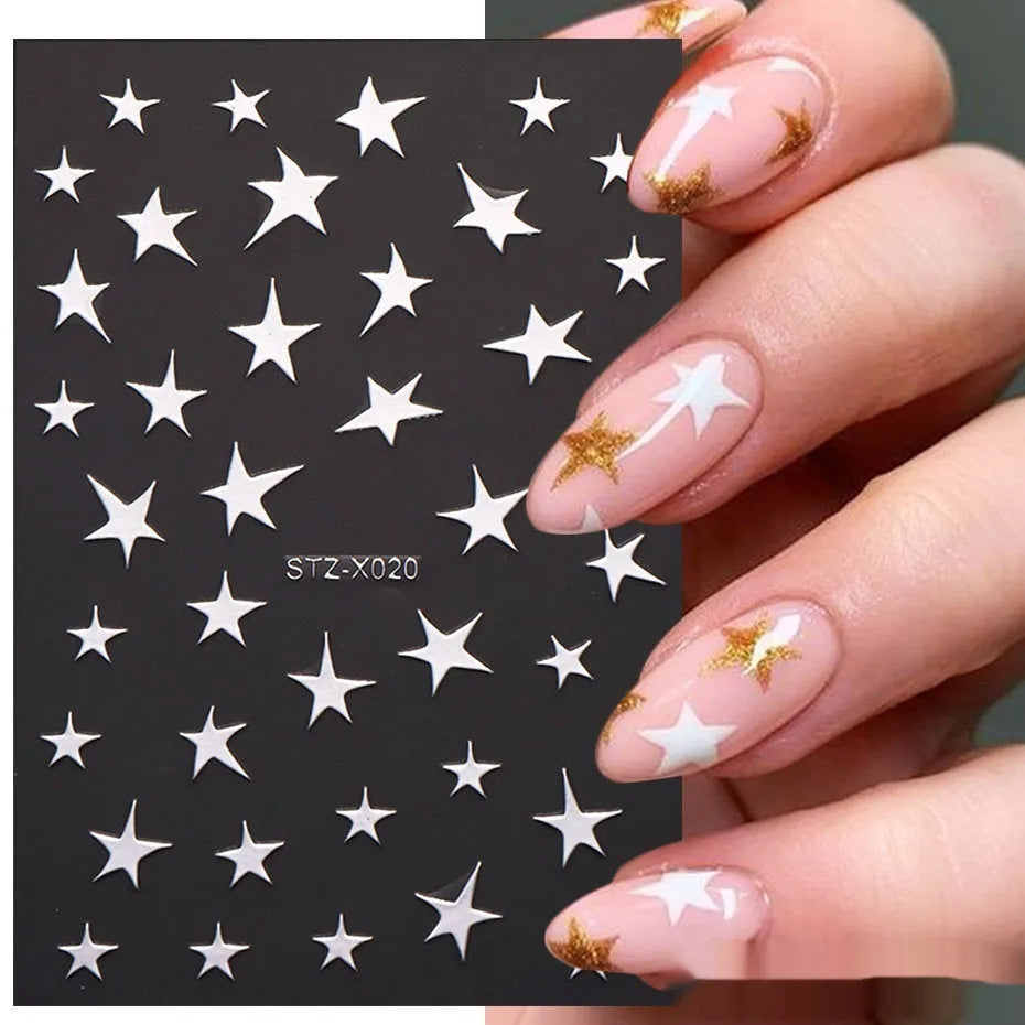 Plastic sheet of black, silver, and cartoon design nail art stickers for DIY manicures.