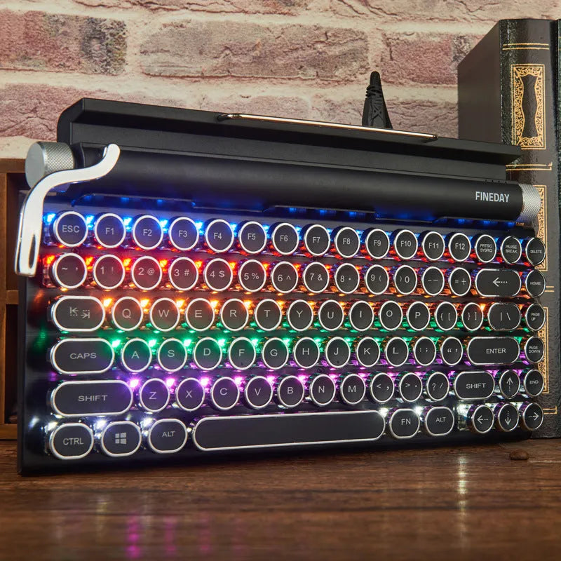 Black retro typewriter style mechanical keyboard with backlit keys on a desk
