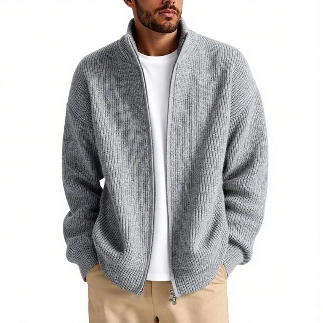 Man wearing a loose-fit grey cardigan sweater coat for casual leisure wear.