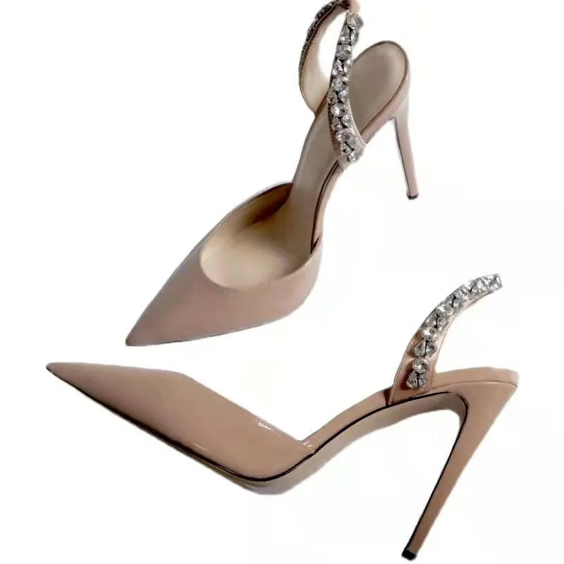 Women's black patent leather rhinestone high heel sandals with pointed toe and ankle strap.