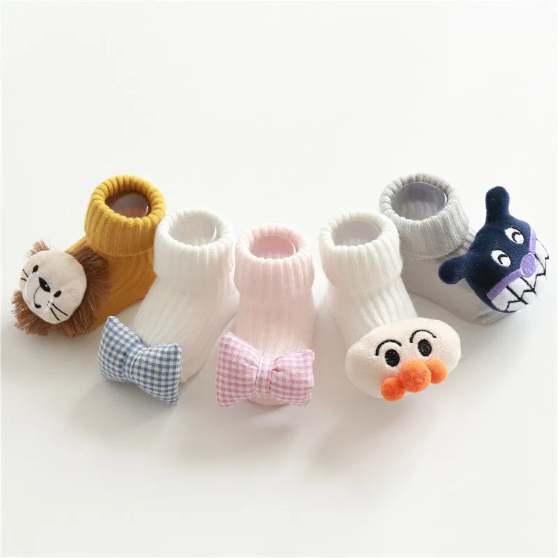 Baby socks in cotton fabric showing Lion, Panda, Blue Bow, and Pink Stars designs for sizes XS, S, M.