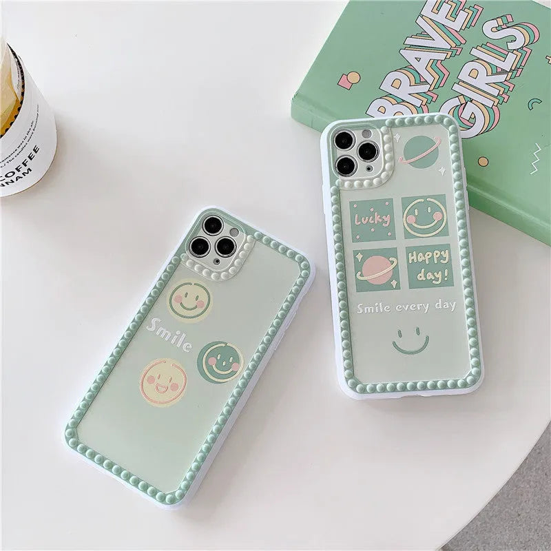 Green TPU iPhone case with geometric pattern and smiley faces in a polka dot frame for multiple models.