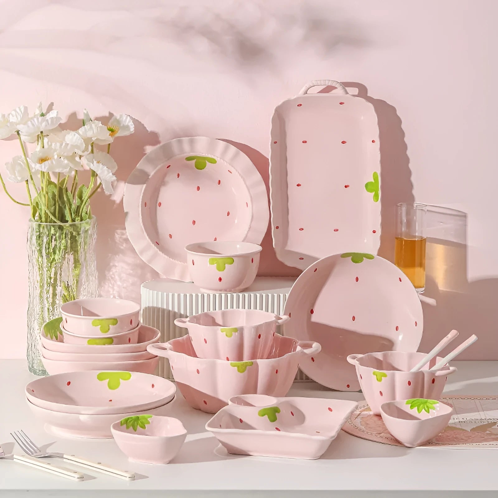 Cute strawberry design porcelain dinnerware set with flower bowls, straw hat plates, and a twist spoon.