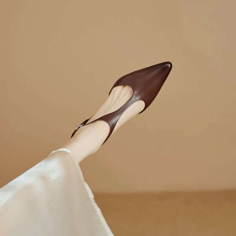 Women's black pointed toe high heels made from cowhide leather.