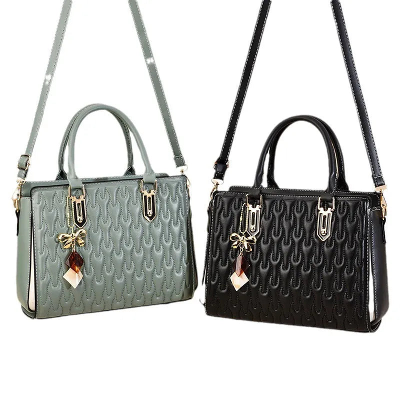 Women's large polyester messenger bag in black with shoulder strap and external pockets.