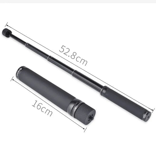 Black retractable selfie stick with Bluetooth remote, extended to full length with a smartphone attached.