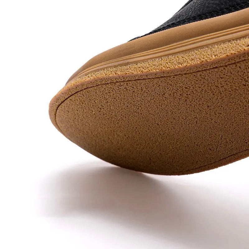 Men's black leather casual shoes with round toe, flat heel, and white lace-up closure.