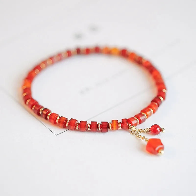 Hand-woven red agate beads bracelet with diamond-shaped arrangements in ethnic style design