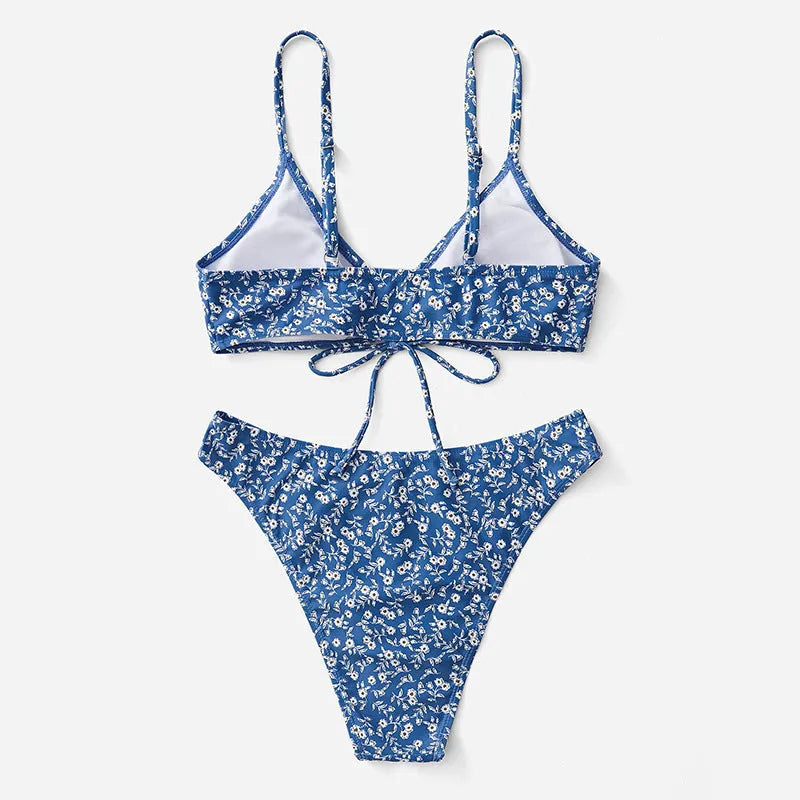Blue three-piece swimsuit set consisting of a top and shorts, made from polyester fabric.
