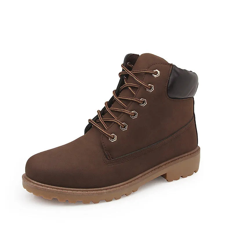 Men's pink high-top Martin boots with front lace-up and a low flat heel on a neutral background.