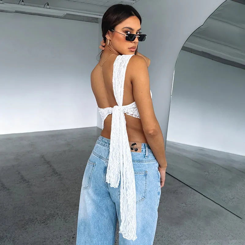 Women's apricot lace backless sleeveless top with an asymmetrical neckline on a hanger.