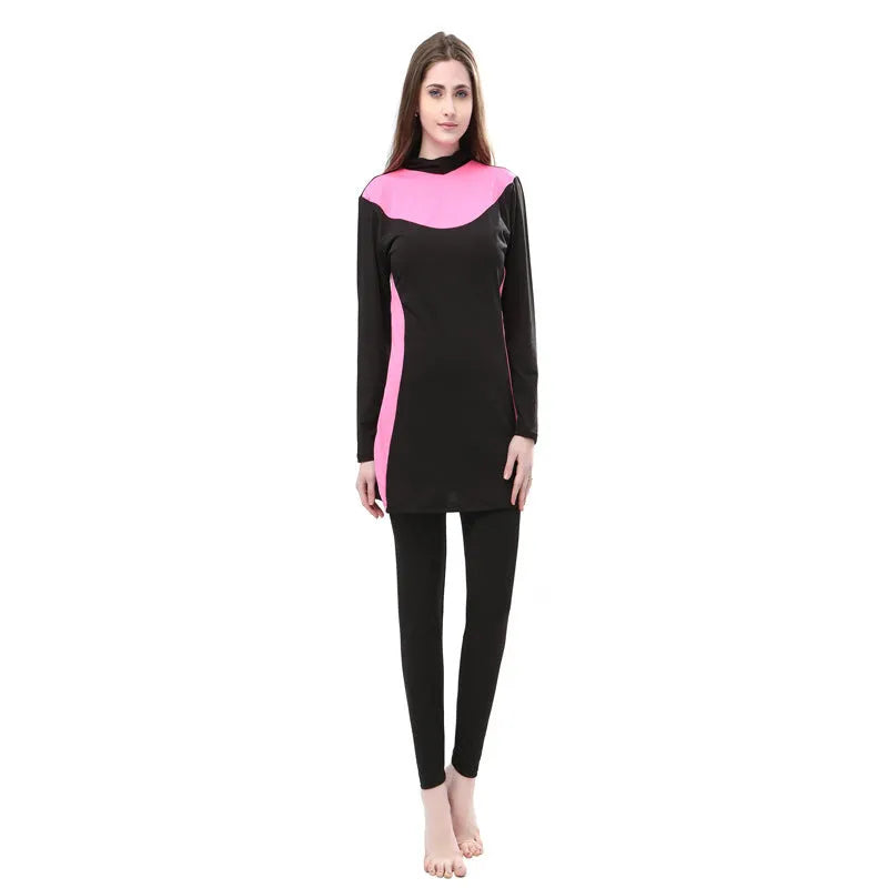 Conservative black women's swimsuit with hood, long sleeves, and full-length pants in a two-piece set.
