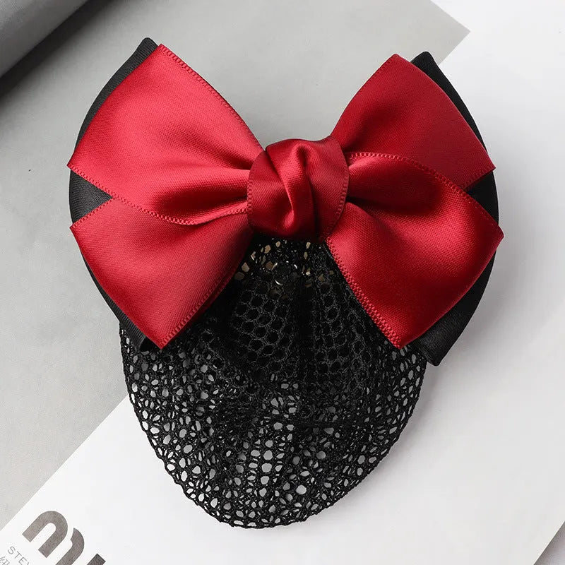 Professional hair clip with a black net pocket and a red flower bow ornament on a white background.