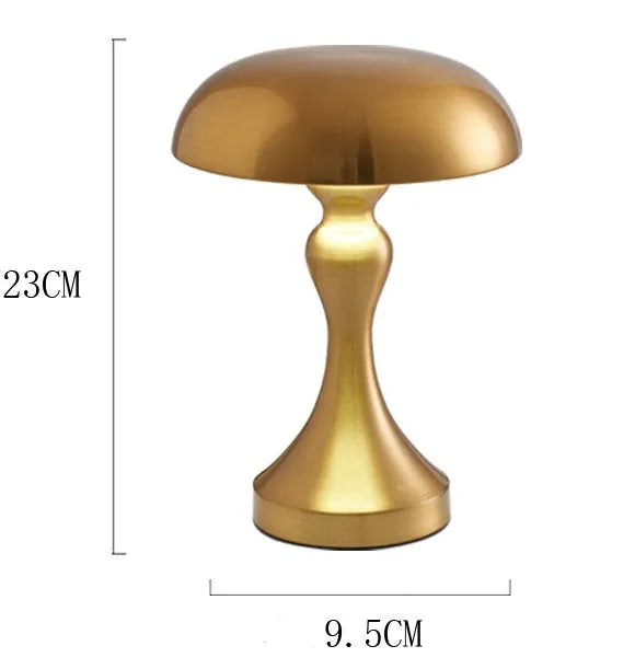 Bronze LED desk lamp with touch control showing three colour temperature settings on wooden desk