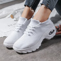 Women's flying knit platform sneakers in black with round toe and waterproof sole