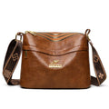 Large capacity multi compartment cross body bag in black with horizontal square shape and sewing thread detail