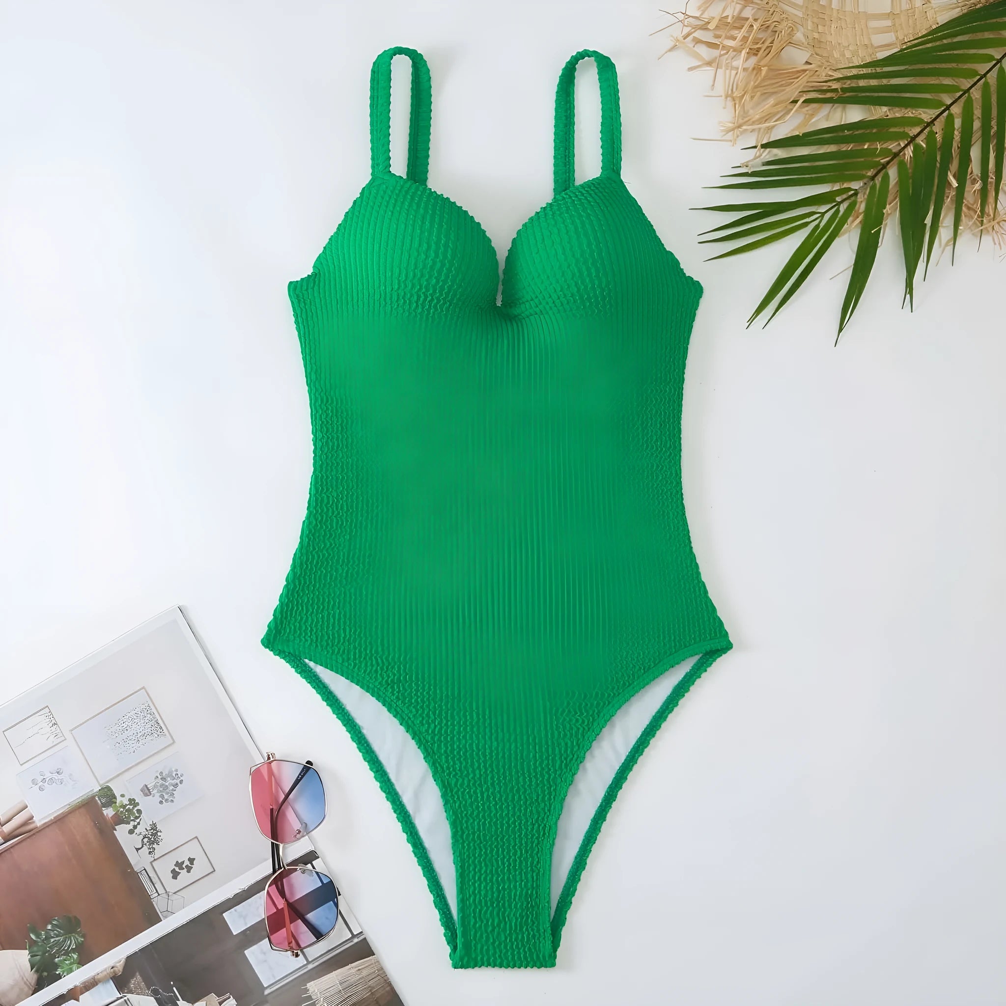 Women's one-piece swimsuit with sunken stripe pattern in polyester fabric, shown in multiple colour options