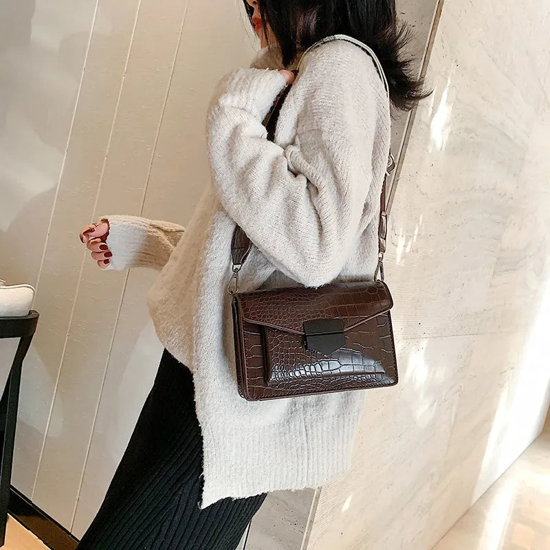 Vintage PU crossbody bag in black, shown with measurements and internal polyester lining