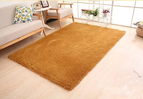 Solid colour plush area rug with non-slip dot-patterned bottom in rectangular shape