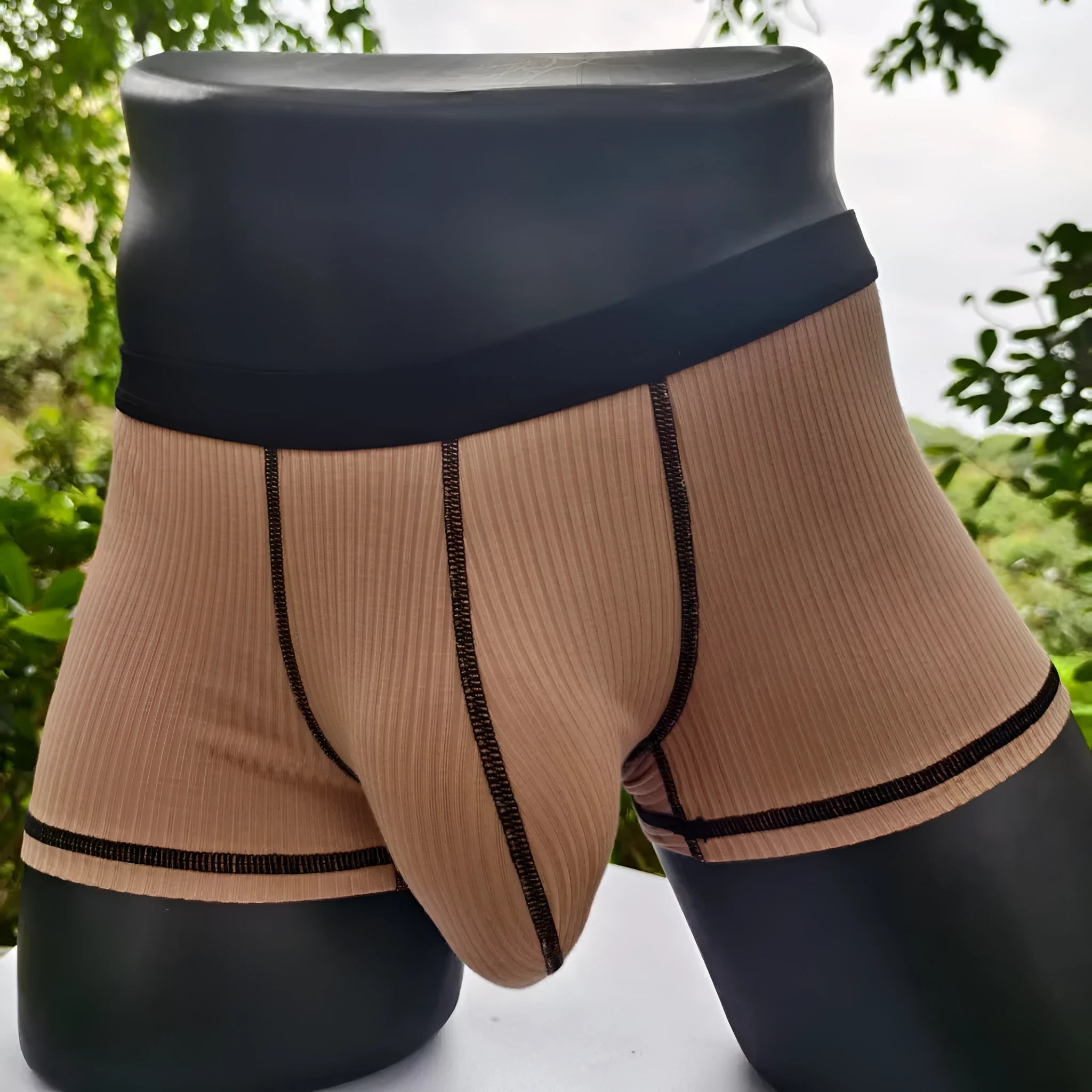 Men's thin fibre boxer shorts in army green, shown laid flat to display hip lift design.