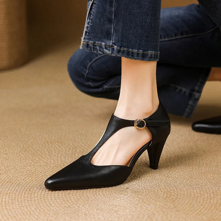 Brown retro women's T-strap sandals with a closed round toe, buckle fastening, and a chunky block heel.
