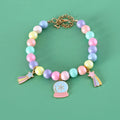 Colourful resin pet jewellery with moon and meteor motifs in macaron colours for dogs and cats