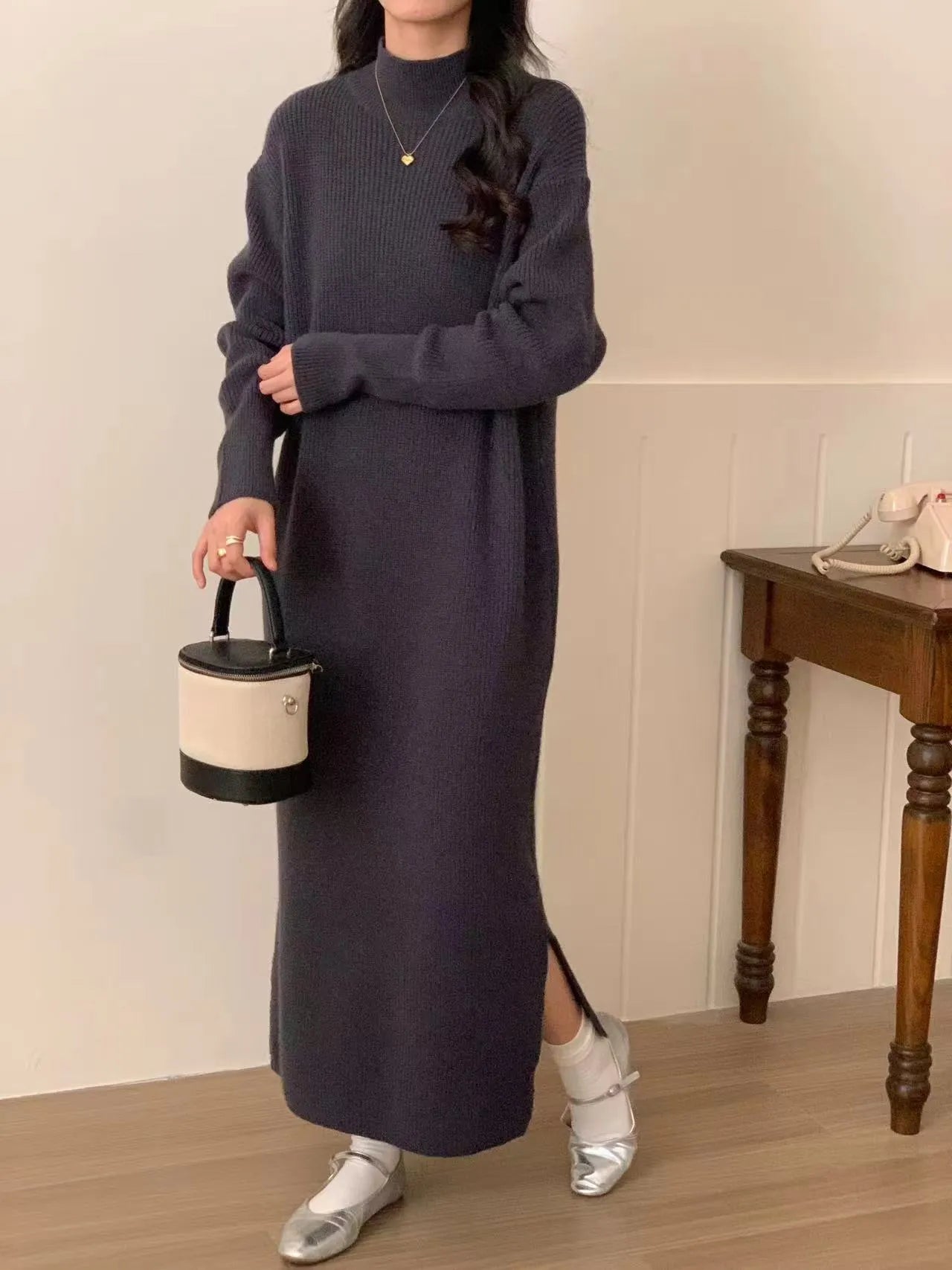 Beige acrylic knit dress with half-turtleneck collar and high waist.