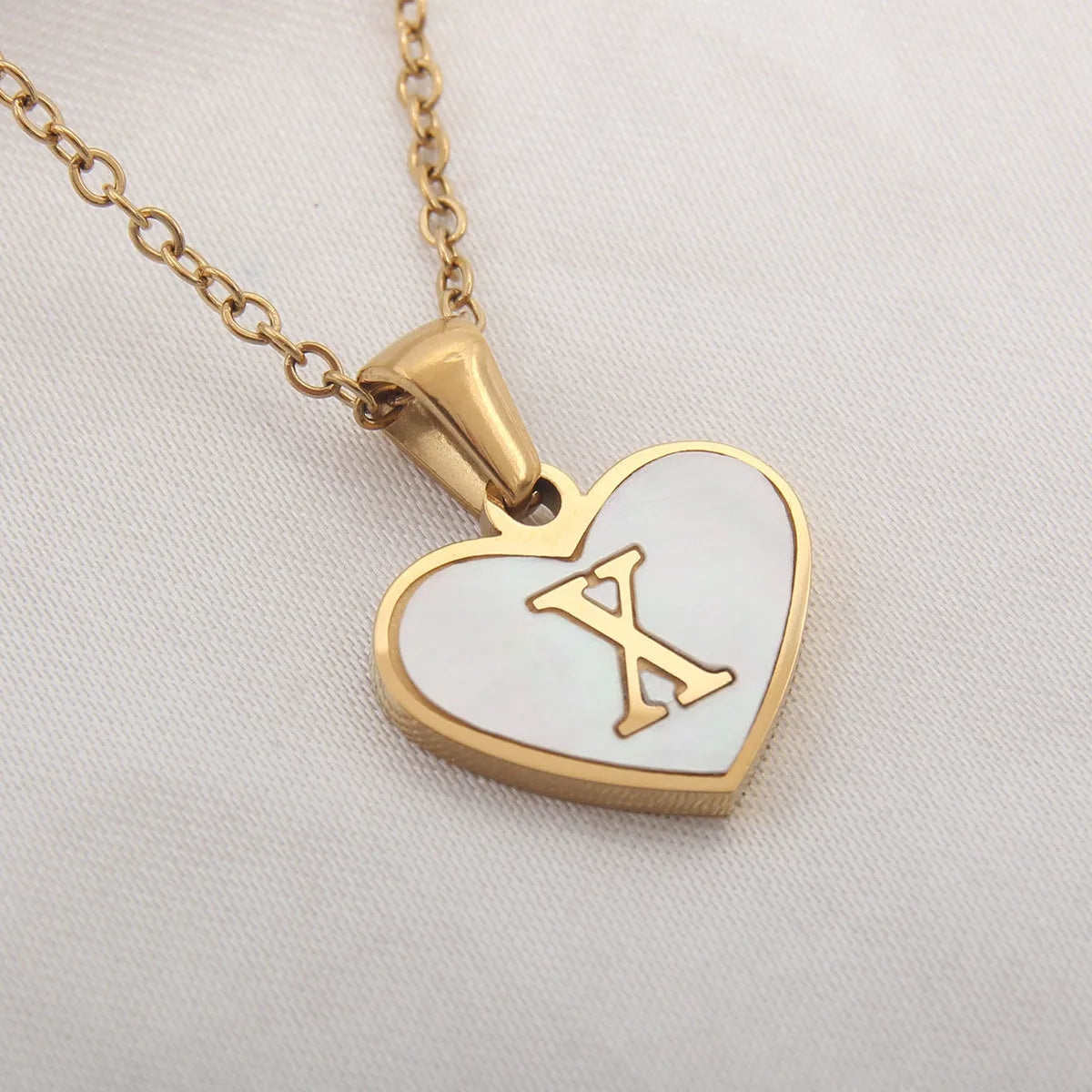 Gold plated personalised heart necklace with white shell on a 45cm chain