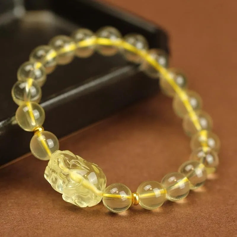 Yellow Chinese pi xiu bracelet with artificial crystal beads on leather cord