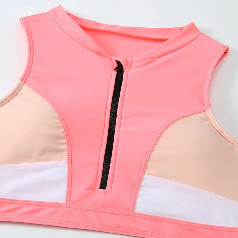 Pink high waisted women's bikini swimsuit with briefs and sleeveless top on mannequin