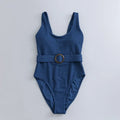 Navy blue women's one-piece swimsuit with slimming triangle silhouette and chest pads for swimming