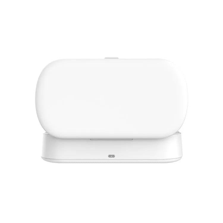 White portable UV steriliser and wireless charging box with aromatherapy function on a desktop