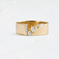 Gold electroplated women's ring with zircon stone on finger, showing copper construction and size options 6-10