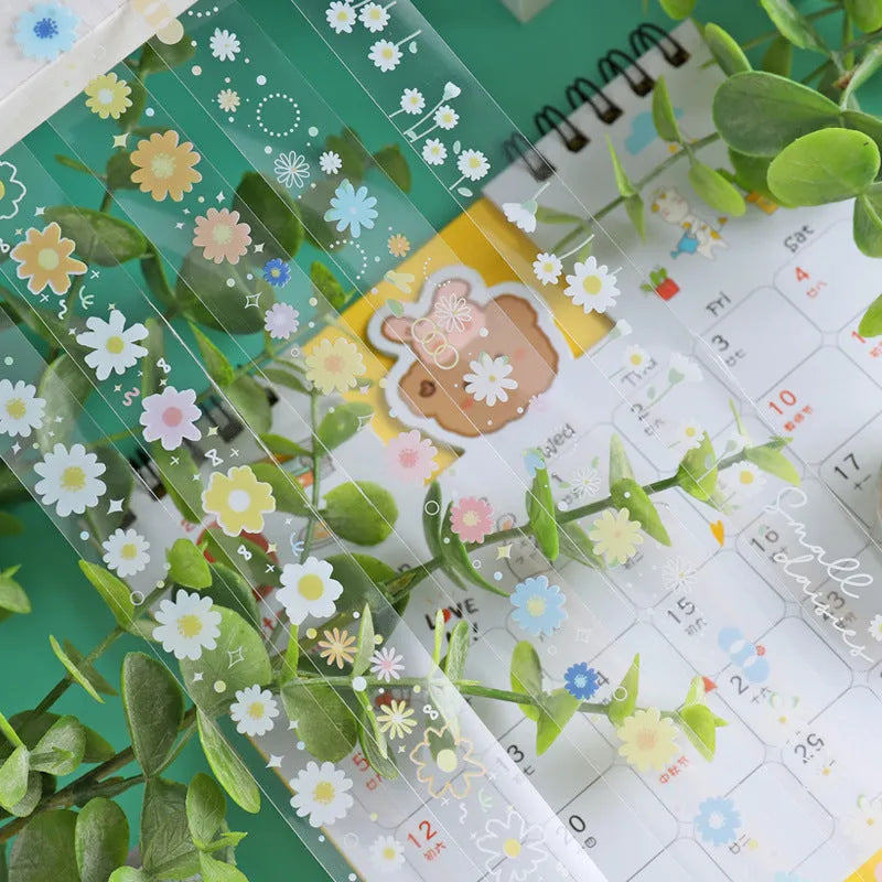 Transparent cartoon decorative adhesive tape rolls showing Midsummer Daisy colour design on clear PET backing