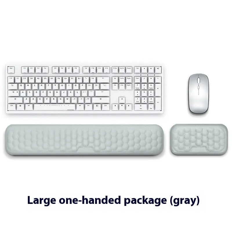 Customisable memory foam mouse wrist pad with black cloth cover on a desk.
