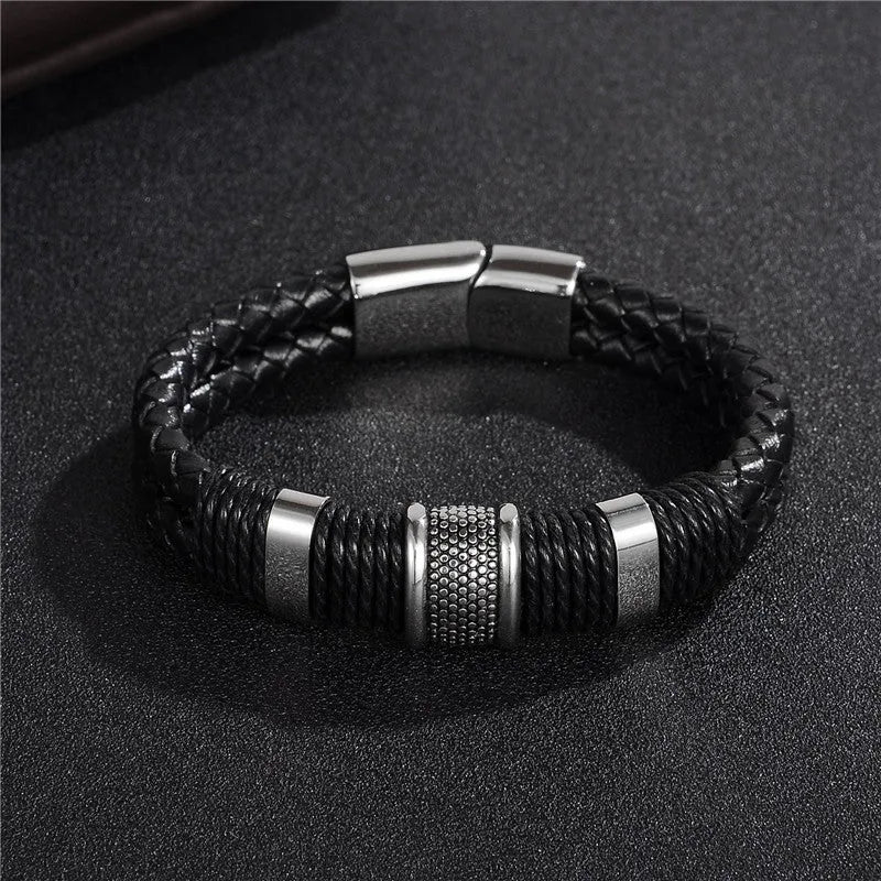Black braid woven leather bracelet with titanium stainless steel accents for men on a neutral background