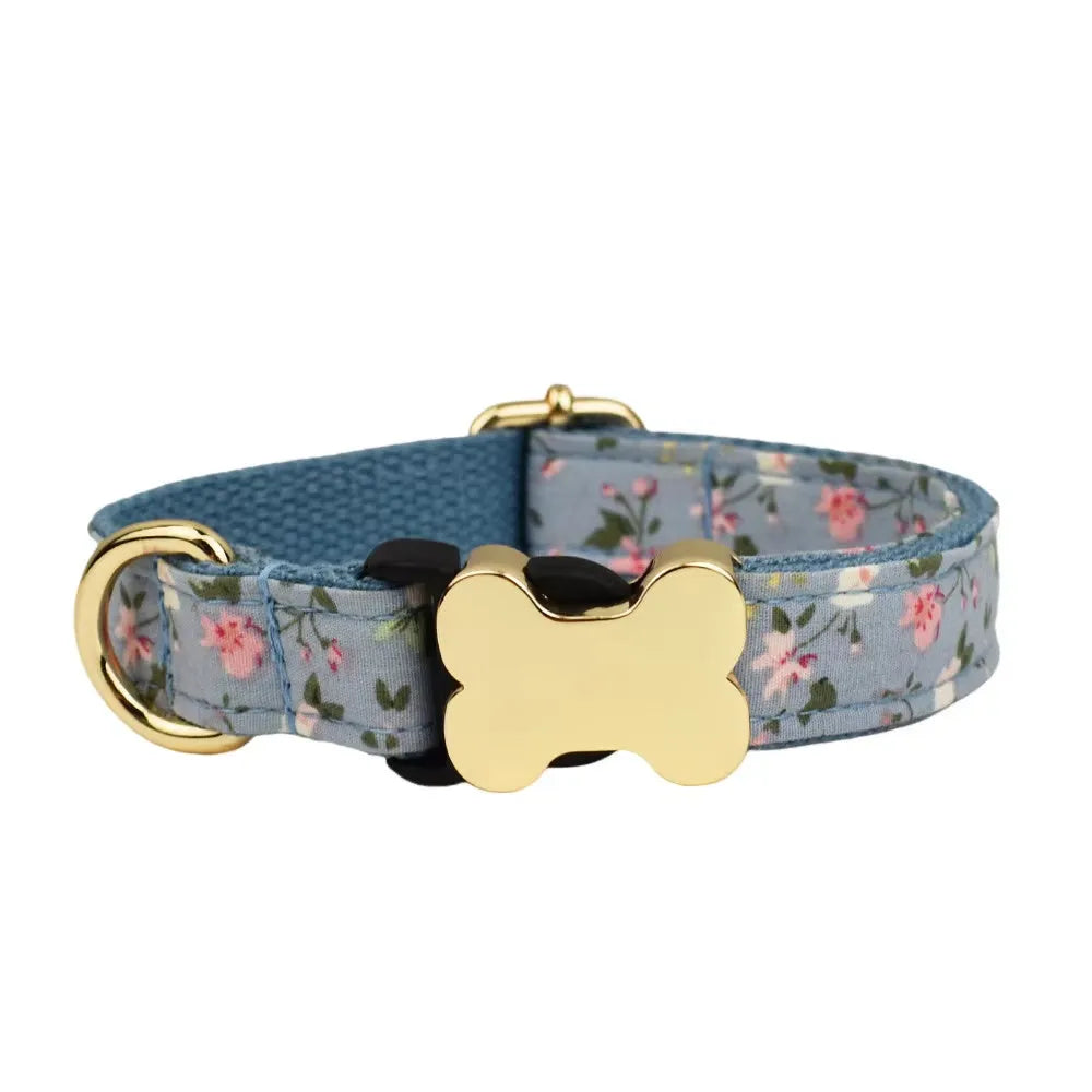 Flat nylon dog collar with a printed grid pattern and a central bone-shaped metal buckle.