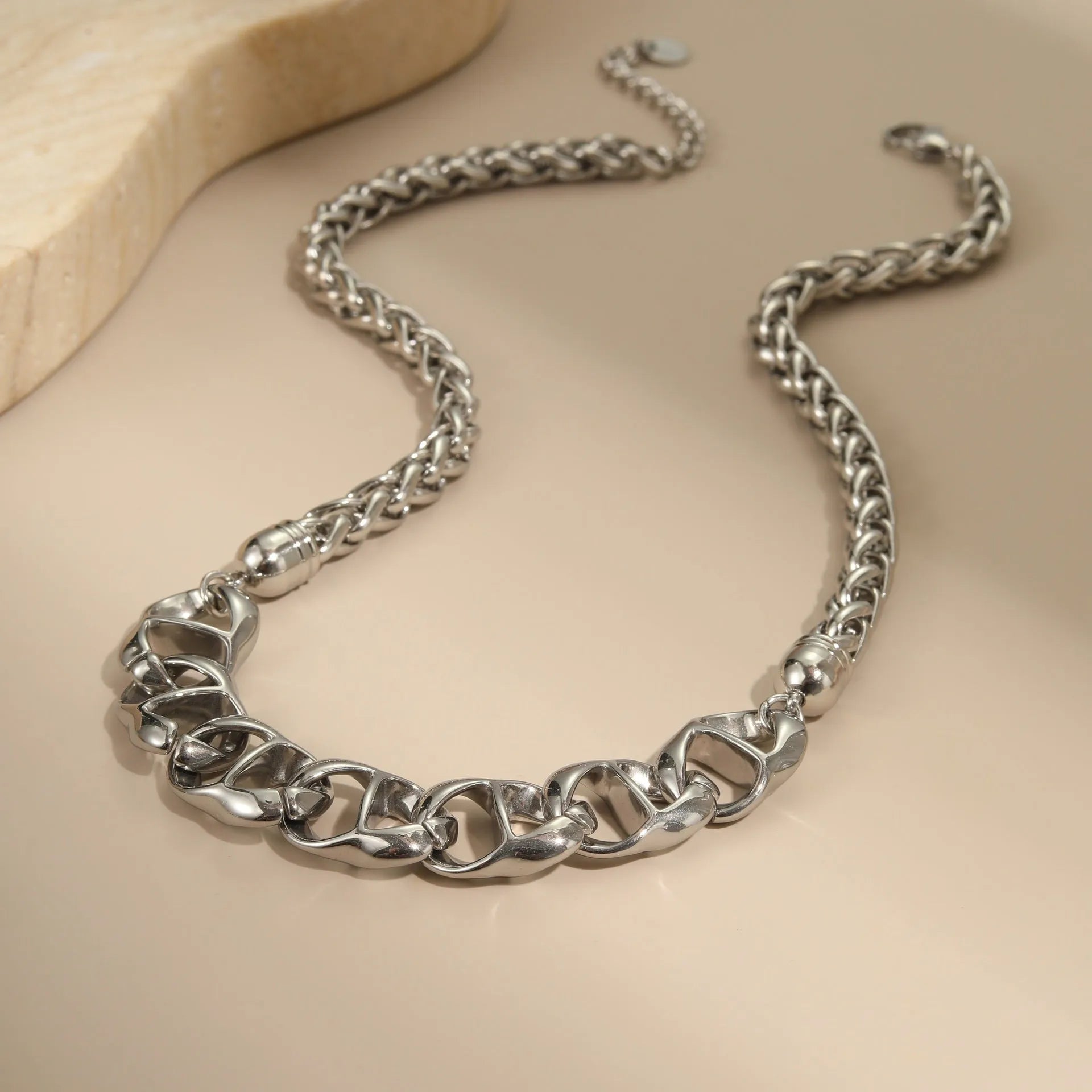Stainless steel necklace with gold electroplated finish and geometric pendant design
