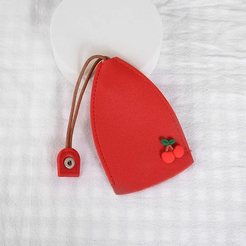 Cartoon pull-out key case in PU leather showing design options including resin fruit and big cartoon animal prints.